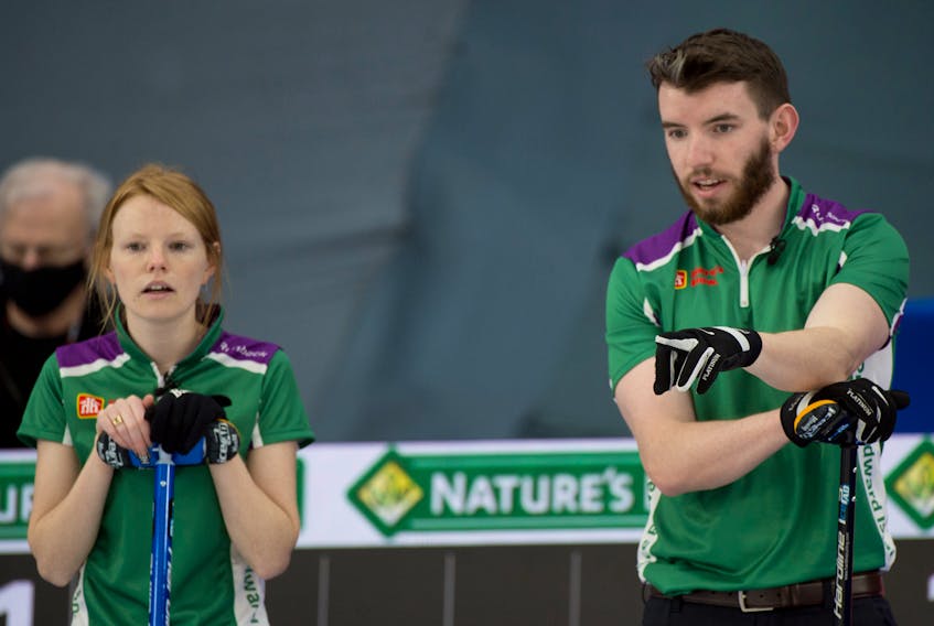 Curling Canada/Michael Burns
Siblings Lauren, left, and Alex MacFadyen of Summerside discuss strategy during the 2021 Home Hardware Canadian mixed doubles curling championship in Calgary. The MacFadyens, who curl out of the Silver Fox in Summerside, were the P.E.I. representatives.