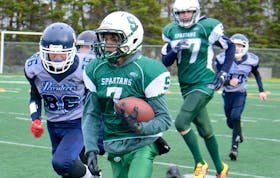 Sam Friesen breaks a big run for the SGK Atlantic Summerside Spartans Saturday in the Ed Hilton Bowl against the Charlottetown Silver Privateers at the Terry Fox Sports Complex in Cornwall.