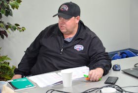 Summerside D. Alex MacDonald Ford Western Capitals' general manager Pat McIver discusses strategy during the Maritime Junior Hockey League Entry Draft on Saturday.