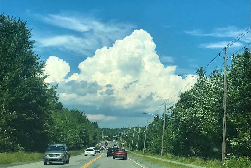 This towering cumulus cloud in Cole Harbour, N.S., is the type of cloud that would give you a sun shower.