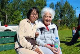['Susie Schule (left), and her mother, Regula, came out to the community barbecue in Happy Valley-Goose Bay on Sept. 9, marking International FASD Awareness Day.']