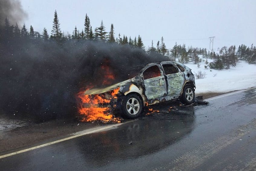 There was a scary incident Monday morning for the driver of this Ford Edge, which caught fire while he was travelling along the Heart’s Content Barrens in stormy and whiteout conditions. There were no injuries in the incident. RCMP photo