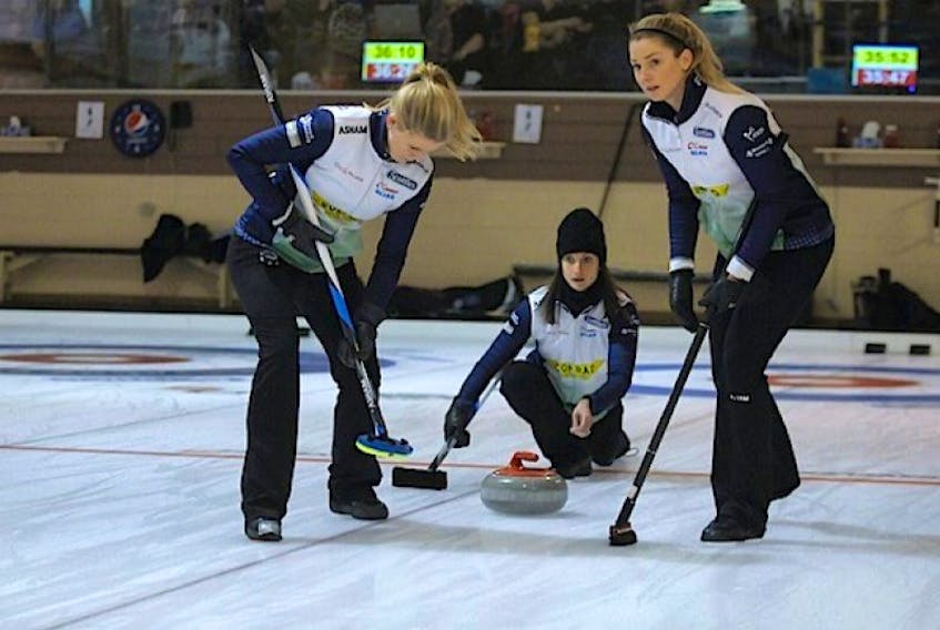 FILE PHOTO: Skip Suzanne Birt delivers a stone while Marie Christianson, left, and Meaghan Hughes prepare to sweep during the 2016 provincial Scotties in Montague.  ©THE GUARDIAN