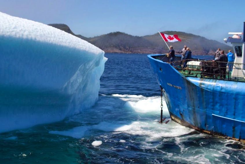 A Canadian flag containing 150 reasons why it’s cool to live in Canada has been planted in one of the giant ice slabs floating through Newfoundland’s Iceberg Alley. 