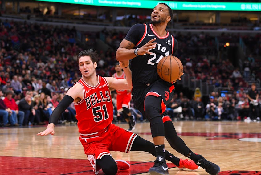 Toronto Raptors forward Norman Powell (24) dribbles the ball past Chicago Bulls guard Ryan Arcidiacono (51) during the second half at the United Center. Mike DiNovo-USA TODAY Sports