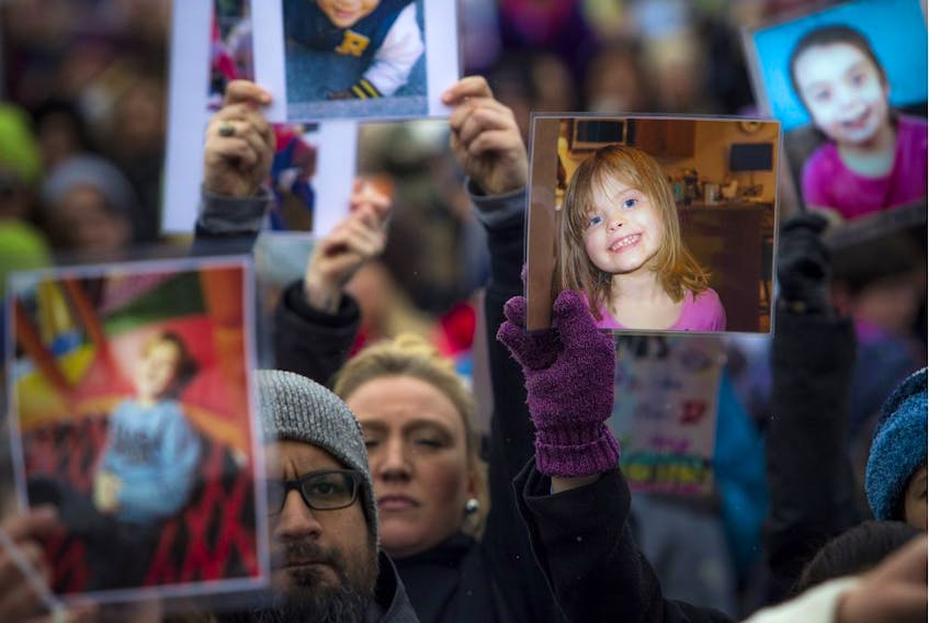 The Next Step Autism March, organized by two autism parents in Barrhaven, Ont.,  made its way to Parliament Hill Sunday March 30, 2019. Autism supporters took a moment of silence, holding up photos of those effected. - Ashley Fraser