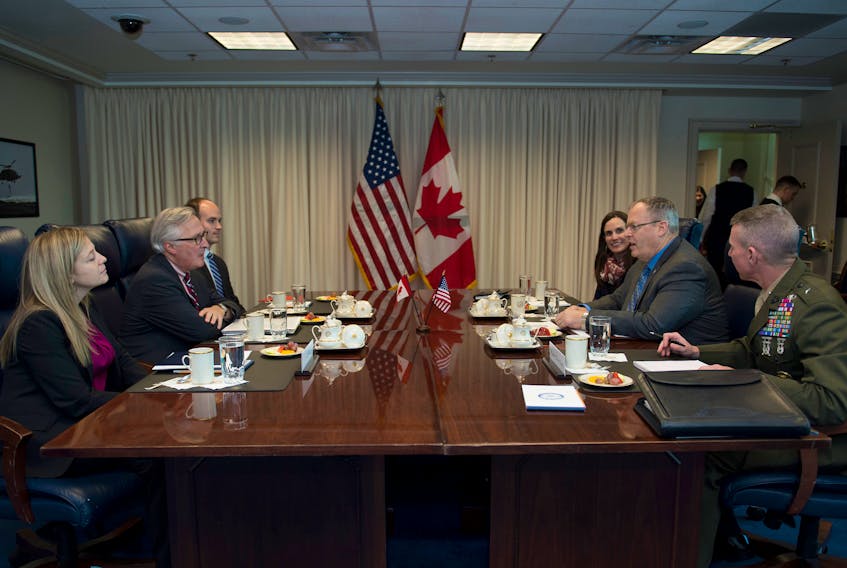 Canadian Deputy Defense Minister Richard Fadden, second left, meets with U.S. Deputy Defense Secretary Bob Work, second right, at the Pentagon in November 2014.