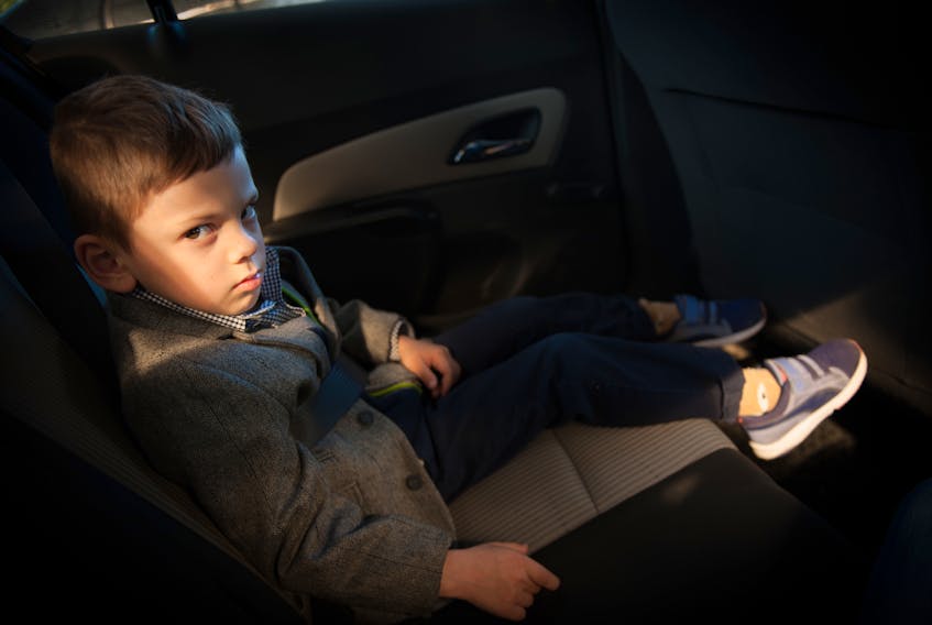 Upset kid in car seat