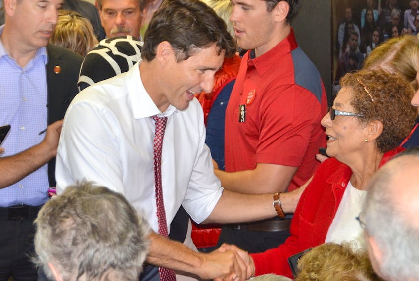 Prime Minister Justin Trudeau shakes hands with Verona Jackson at Bruce-Grey-Owen Sound Liberal candidate Michael Den Tandt's campaign office on Wednesday, September 4, 2019 in Owen Sound, Ont. - Rob Gowan/Postmedia Network