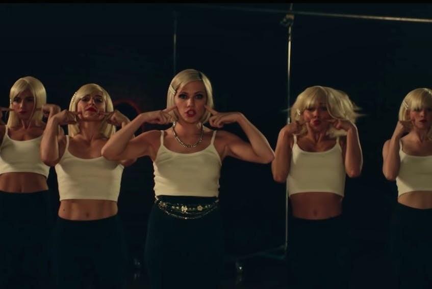 Carly Rae Jepson, centre, in the video for "Too Much" off of her recent "Dedicated" album.