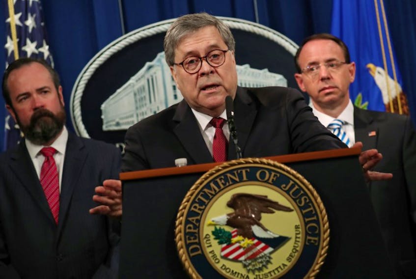 U.S. Attorney General William Barr, flanked by Edward O'Callaghan, Acting Principal Associate Deputy Attorney General (L) and Deputy U.S. Attorney General Rod Rosenstein, speaks at a news conference to discuss Special Counsel Robert Mueller’s report on Russian interference in the 2016 U.S. presidential race, in Washington, U.S., April 18, 2019.