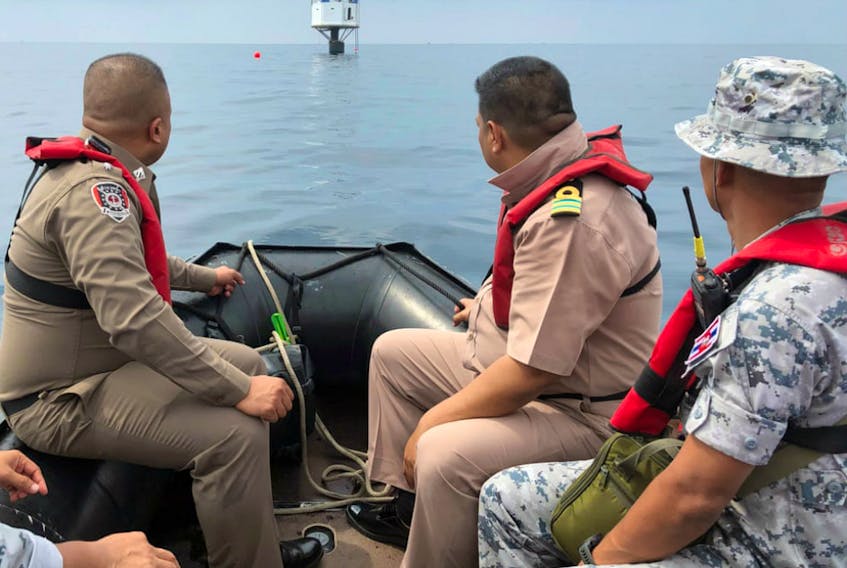 Thai naval officers and marine police inspect a ‘seastead’ in the Andaman Sea off the coast of Phuket island, southern Thailand. - Royal Thai Navy Handout/EPA via Postmedia
