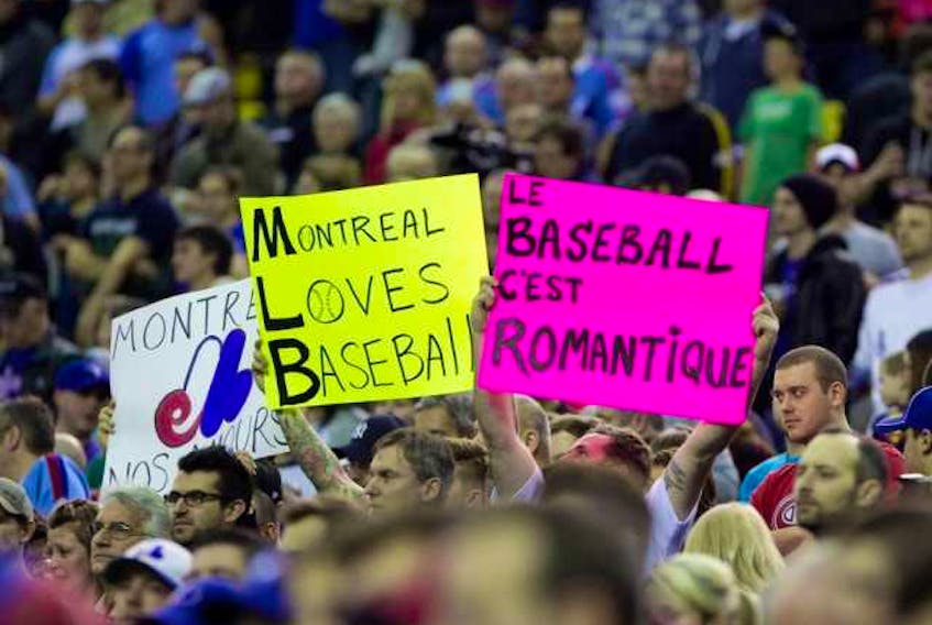 Montreal baseball fans fill the stands during preseason Major League Baseball between the Toronto Blue Jays and the New York Mets at the Olympic Stadium in Montreal on March 28, 2014. ALLEN MCINNIS / MONTREAL GAZETTE FILES