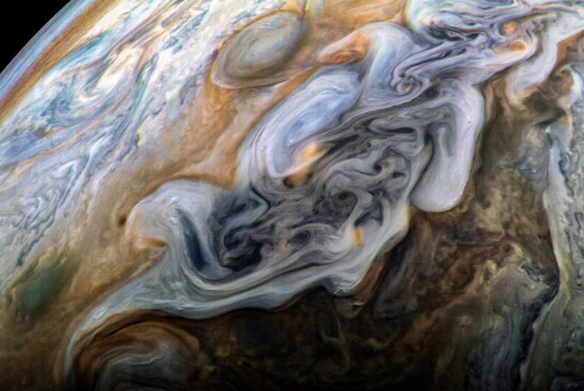 The swirls of Jupiter are visible in this colour-enhanced image created May 23, 2018 by NASA's Juno spacecraft. — NASA/JPL-Caltech/SwRI/JunoCam