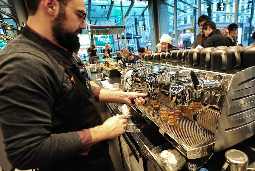Opening day action as Starbucks revealed its latest and largest store, the new Starbucks Reserve Bar in Vancouver, B.C., Dec. 11, 2018.