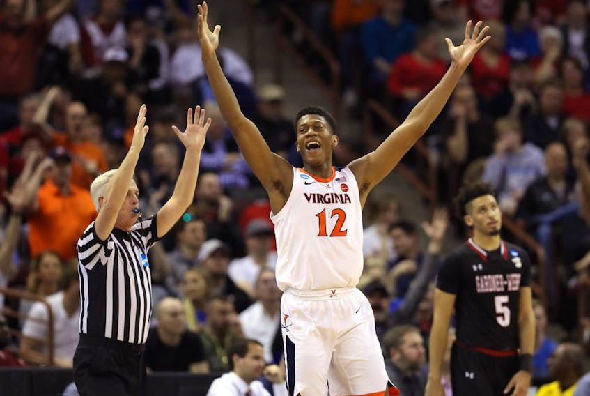 De'Andre Hunter #12 of the Virginia Cavaliers celebrates after a play in the second half against the Gardner Webb Runnin Bulldogs during the first round of the 2019 NCAA Men's Basketball Tournament at Colonial Life Arena on March 22, 2019 in Columbia, South Carolina. (Photo by Streeter Lecka/Getty Images)