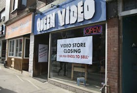 After 38 years in business, Queen Video will close the doors at its last remaining location at 480 Bloor St. W. on April 28. The closed sign is seen here in the shop's window on March 22, 2019. (Veronica Henri/Toronto Sun/Postmedia Network)