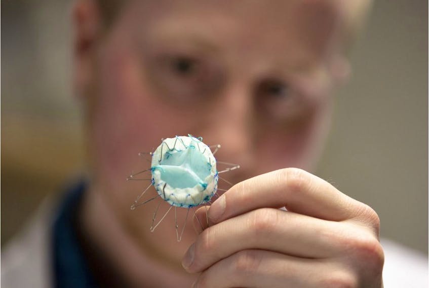 Dylan Goode, a graduate researcher at Heart Valve Performance Laboratory at UBC Okanagan's School of Engineering holds the first-ever nanocomposite biomaterial heart-valve developed to reduce or eliminate complications related to heart transplants.