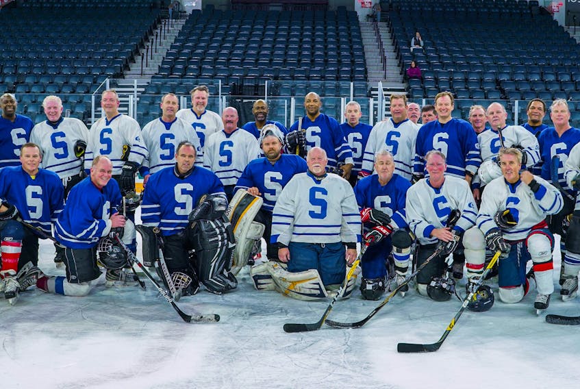 Former Sydney Academy hockey players held an alumni game at the Scotiabank Centre in Halifax in November. The players proudly wore their blue and white jerseys during the game. The players who participated in the game, not in order, include Richie Walcott, Gary Drohan, Kenny Douglas, David MacLennan, Kenny Ruck, Albert Nordine, Mike MacCormick, Mark Saunders, Keith MAcNamara, Benny Kirton, David Graham, Mike Murphy, Andy Sophocleus, Kenny Bickerton, Scott MacEachern, Bill Penney, Danny Graham, Chuckie Barrington, Geoff Saunders, Eric Parsons, Glen Joseph, Mike Peck, Glenn MacDougall, John MacIntyre, Blair Donovan, Peter Morrison, Gordie Kiley, Dana MacQueen, Frank MacNeil and Ron Mann. PHOTO SUBMITTED/KENNY BICKERTON