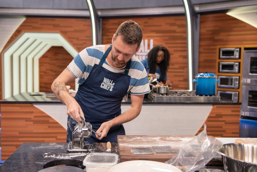Sydney native Jamie Deveaux rolls out some dough while taking part in the Food Network’s Wall of Chefs. Deveaux won the episode and took home a $10,000 prize. CONTRIBUTED/FOOD NETWORK

