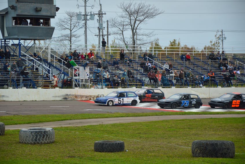 The checkered flag is waved as the cars cross the finish line in one of the stock car races at Sydney Speedway last October. Sydney Speedway is already preparing for its 2021 racing season. NICOLE SULLIVAN • CAPE BRETON POST 