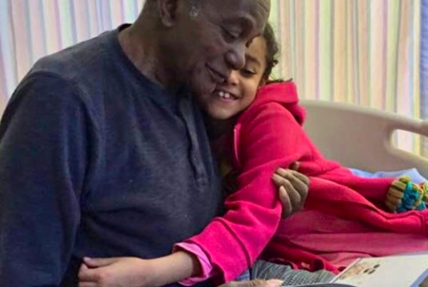 Kiana MacDonald hugs her grandfather Roy King on his 91st birthday in on May 1, 2019, at the Glace Bay Hospital. King died on March 30 and his family has been waiting to bury him because cemeteries have been closed due to COVID-19 health protection orders in Nova Scotia. CONTRIBUTED 