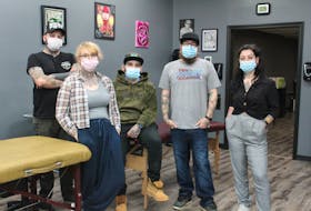 The tattoo and piercing artists at The 9th Gate Gallery in the Keltic Plaza in Sydney River in their shop on Saturday. The business has reopened following the COVID-19 shutdown. From left, front, Rinn Pollock, Luke Cormier and Jenna Hupola, back, Devin O'Brien and Frank Decker. NICOLE SULLIVAN/CAPE BRETON POST 