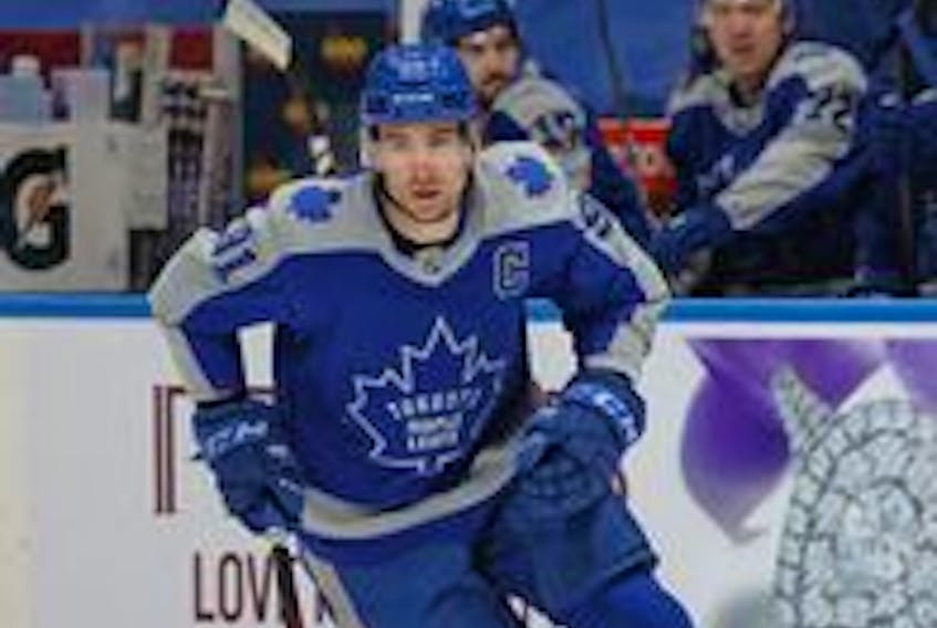 Maple Leafs captain John Tavares, shown here, spent some time playing alongside Auston Matthews and Mitch Marner on Monday night against Calgary. The trio was held off the scoresheet. 
