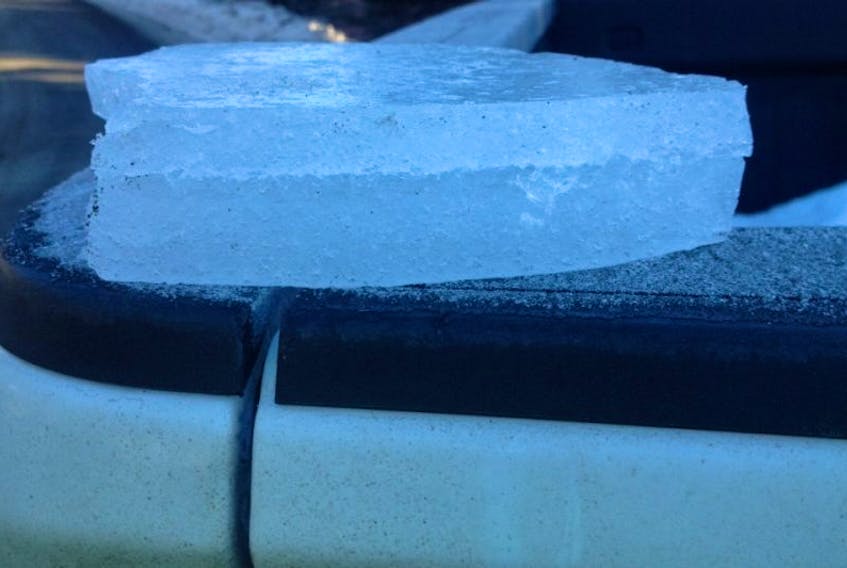 This piece of ice came off the roof of a white cargo van in Ferndale this morning and landed on the windshield of a passing pickup truck.