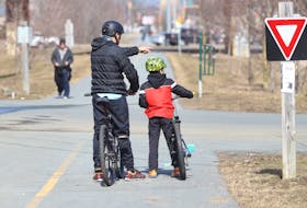 FOR NEWS STORY:
Chris Vanderwelt and his son Jacob, 8, determine their next route, while taking the rails to trails path in Halifax Friday March 12, 2021. The federal government announced the first federal fund for cycling paths and trails across the country.