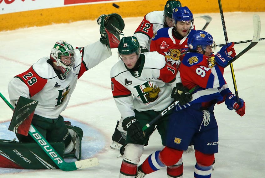 Halifax Mooseheads goalie Cole McLaren reaches up to grab a high shot in traffic during QMJHL action against the Moncton Wildcats on Friday at the Scotiabank Centre.  TIM KROCHAK / The Chronicle Herald
