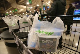 Groceries packed in a plastic bag wait in a shopping cart at the Windsor Street Sobeys on Thursday, January 16, 2020.
