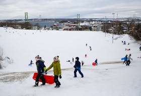 FOR STORM STORY:
Youths take advantage of the snow, and the snow day, at The Pit in Merv Sullivan Park, following a winter storm in Halifax Monday February 8, 2021. 
TIM KROCHAK PHOTO
