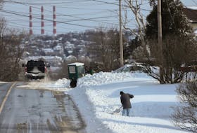 FOR STORM STORY:
A man digs out his snow-covered driveway on Main Avenue, following a winter storm in Halifax Monday February 8, 2021. 
TIM KROCHAK PHOTO