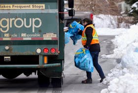 FOR PEDDLE STORY:
A worker picks up bags of recycling in St. Margaret's Bay Rd area neighborhood in Halifax Friday February 12, 2021.

TIM KROCHAK PHOTO