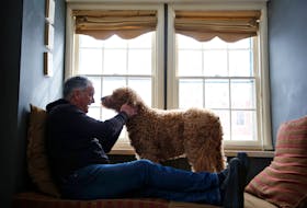 FOR DEMONT COLUMN:
Jon Demont is seen with his dog, Auggie, in his Halifax home Monday February 22, 2021.

TIM KROCHAK PHOTO