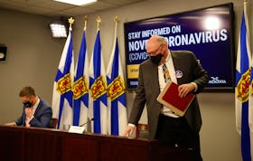 FOR NEWS STORY:
Nova Scotia's new Premier, Iain Rankin,  and province's chief medical officer, 
Dr. Robert Strang departs after taking part in their first COVID-19 news conference together, in Halifax Wednesday February 24, 2021.

TIM KROCHAK PHOTO