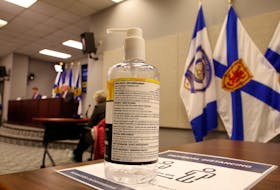 FOR NEWS STORY:
A bottle of hand sanitizer is seen as Nova Scotia's new Premier, Iain Rankin,  and province's chief medical officer, 
Dr. Robert Strang conduct their first COVID-19 news conference together, in Halifax Wednesday February 24, 2021.

TIM KROCHAK PHOTO