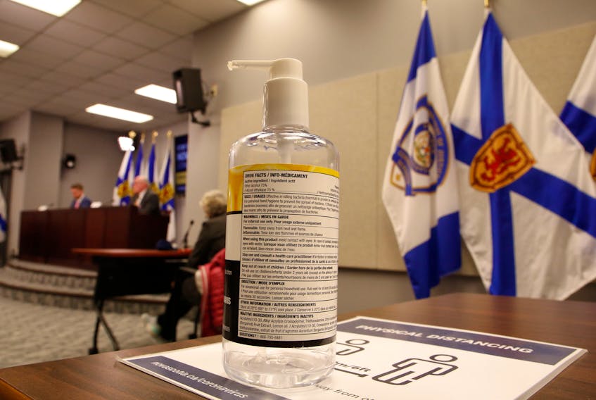 FOR NEWS STORY:
A bottle of hand sanitizer is seen as Nova Scotia's new Premier, Iain Rankin,  and province's chief medical officer, 
Dr. Robert Strang conduct their first COVID-19 news conference together, in Halifax Wednesday February 24, 2021.

TIM KROCHAK PHOTO