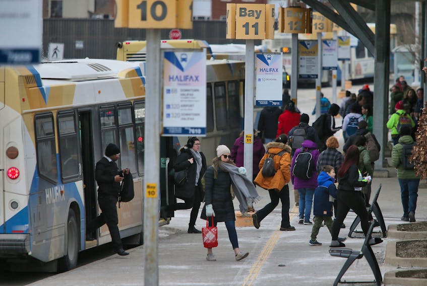 Halifax Transit passengers disembark from buses at the Bridge Terminal in Dartmouth on Monday, March 9, 2020.