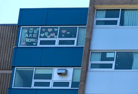 A resident's message to the outside world is taped to a window at the Northwood long-term care facility in Halifax on Wednesday, May 6, 2020.