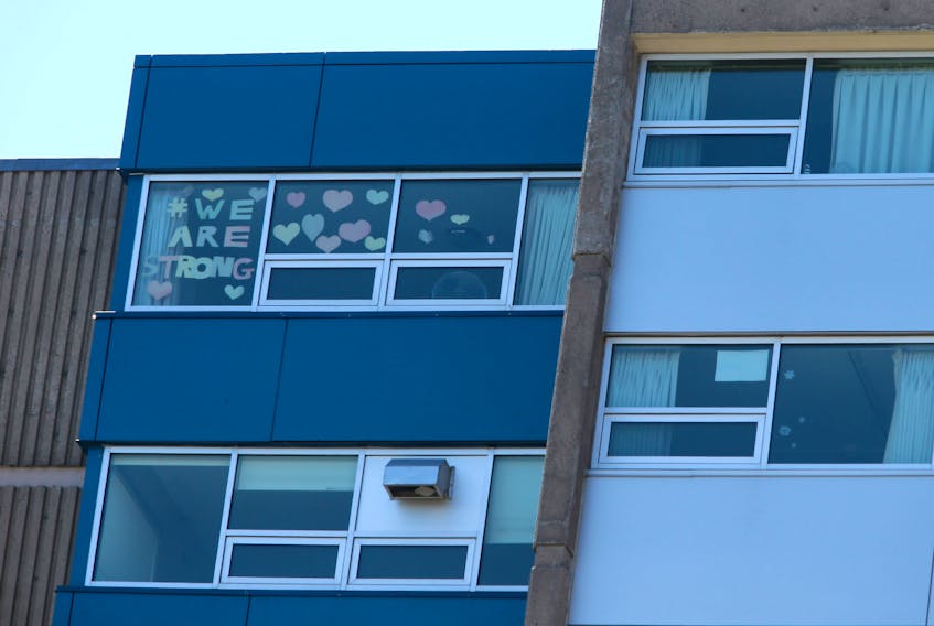 A resident's message to the outside world is taped to a window at the Northwood long-term care facility in Halifax on Wednesday, May 6, 2020.
