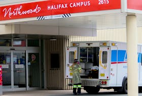 A paramedic in personal protective equipment is seen outside Northwood in Halifax on Friday, May 15, 2020.