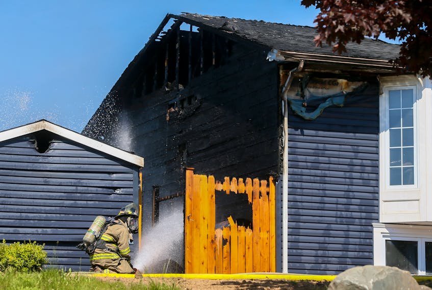 Halifax regional firefighters knock down a blaze, that caused significant damage to a home on Bayswater Road in Dartmouth on Thursday June 18, 2020. There were no injuries and the cause is under investigation.