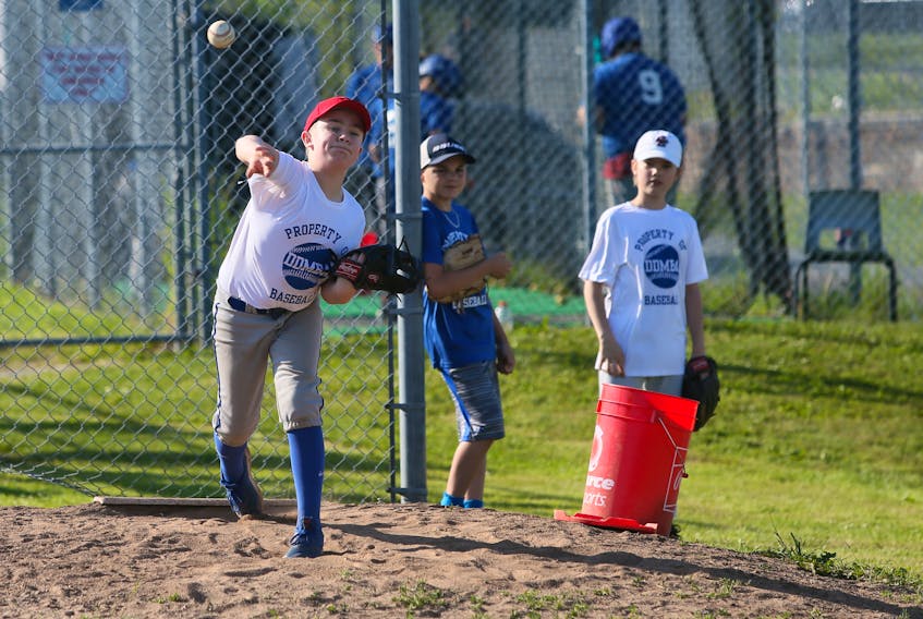 Players have their throwing arms tested during tryouts for the Dartmouth Arrows AAA U13s at Beazley Field in Dartmouth Thursday. Increased numbers for groups is a boost for provincial sport groups. TIM KROCHAK/ The Chronicle Herald