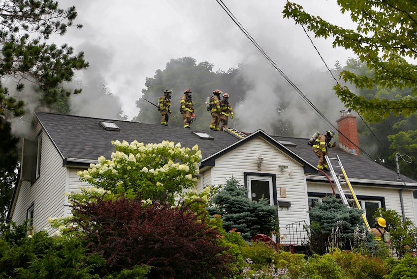 FOR NEWS STORY:
Halifax regional firefighters survey from the roof of a house, as the battle a structure fire at 2779 Joe Howe in Halifax Monday August 3, 2020. Did not appear to be any injuries....

TIM KROCHAK PHOTO