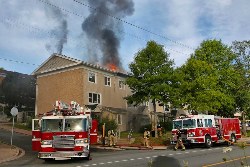 FOR NEWS STORY:
Halifax regional firefighters battle a blaze in the 3000 block of Barrington Street Tuesday morning. One person was taken to hospital, the fire caused extensive damage to one unit in particular and an investigation to its cause with be held.

TIM KROCHAK PHOTO