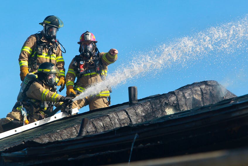 FOR NEWS STORY:
Halifax regional firefighters battle a blaze from the roof of A 3000 block unit on Barrington Street Tuesday morning. One person was taken to hospital, the fire caused extensive damage to one unit in particular and an investigation to its cause with be held.

TIM KROCHAK PHOTO