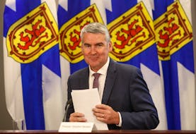 FOR RANKIN STORY:
Nova Scotia Premier Stephen McNeil, smiles and gathers his notes after giving notice of stepping down as the premier of the province, in Halifax Thursday August 6, 2020.

TIM KROCHAK PHOTO