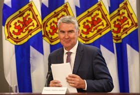 FOR RANKIN STORY:
Nova Scotia Premier Stephen McNeil, smiles and gathers his notes after giving notice of stepping down as the premier of the province, in Halifax Thursday August 6, 2020.

TIM KROCHAK PHOTO